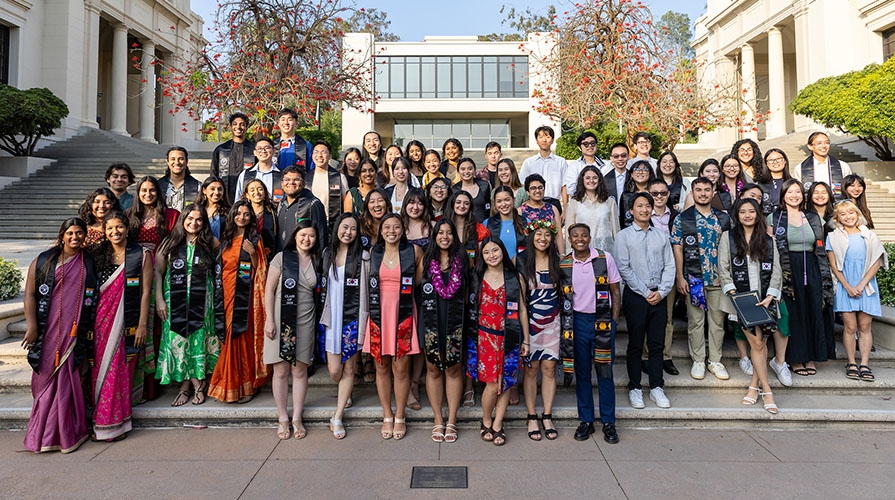 A group of API Graduates posing at their cultural graduation ceremony