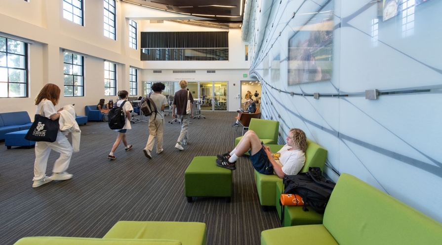 students walking through the lobby in Johnson Hall on the Occidental campus