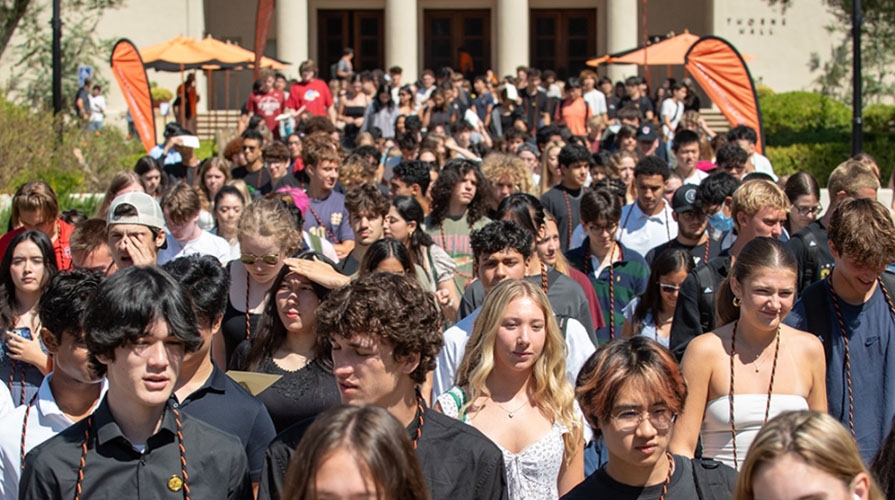 a crowd of Occidental students walking out of Thorne Hall on campus