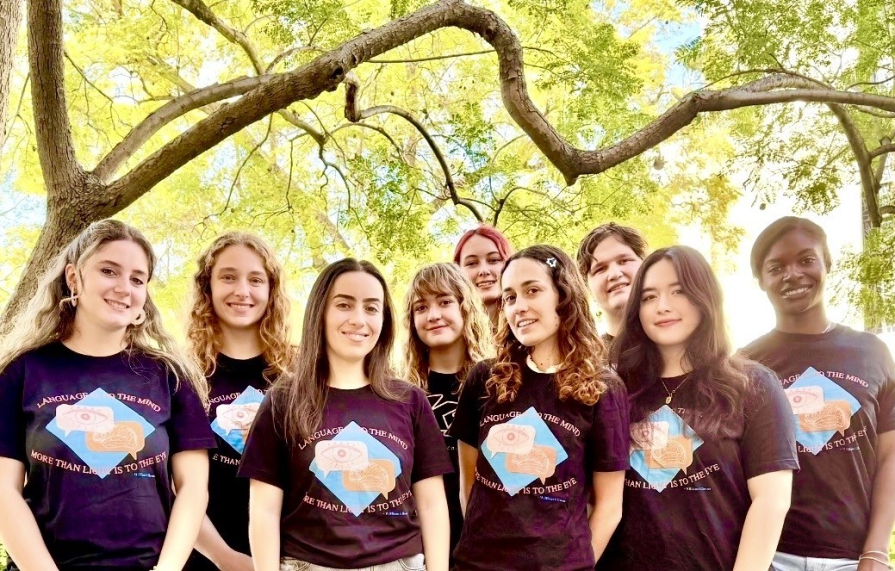 Peer Tutors, Visiting Language Assistants, and Language Table Leaders wearing matching t-shirts.