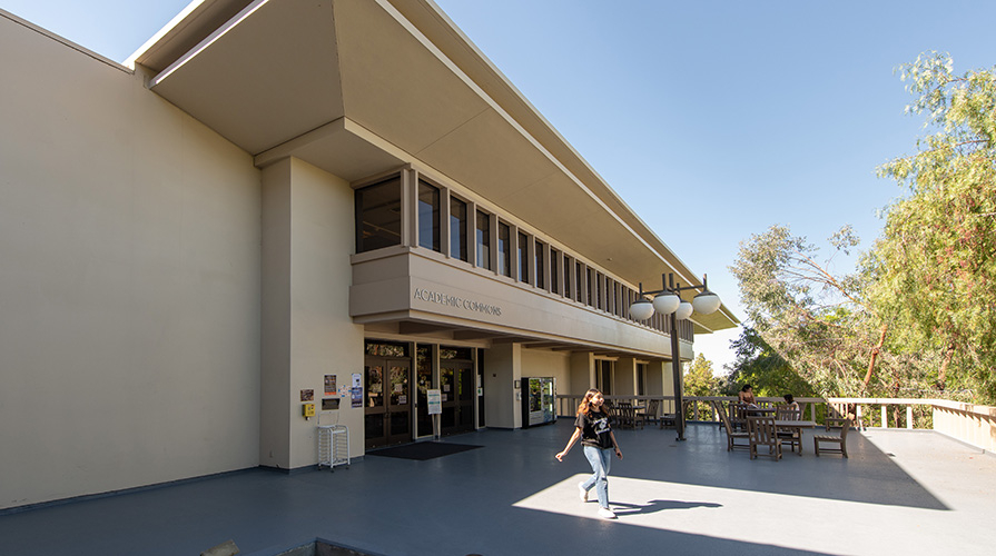 A student walks away from the Academic Commons at Occidental College in Los Angeles