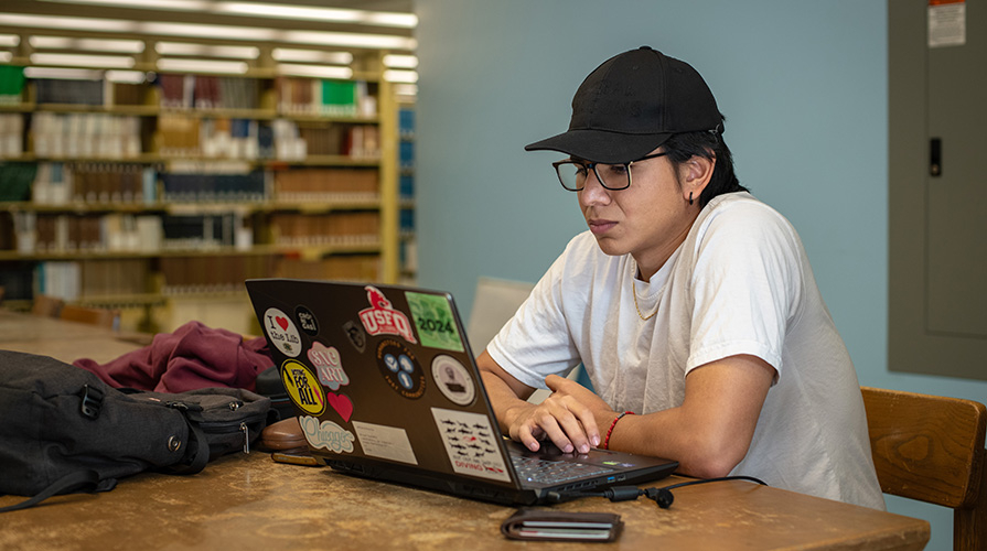 An Occidental student studies in the Academic Commons