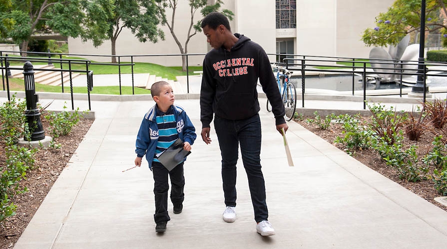 An Oxy student and a young child