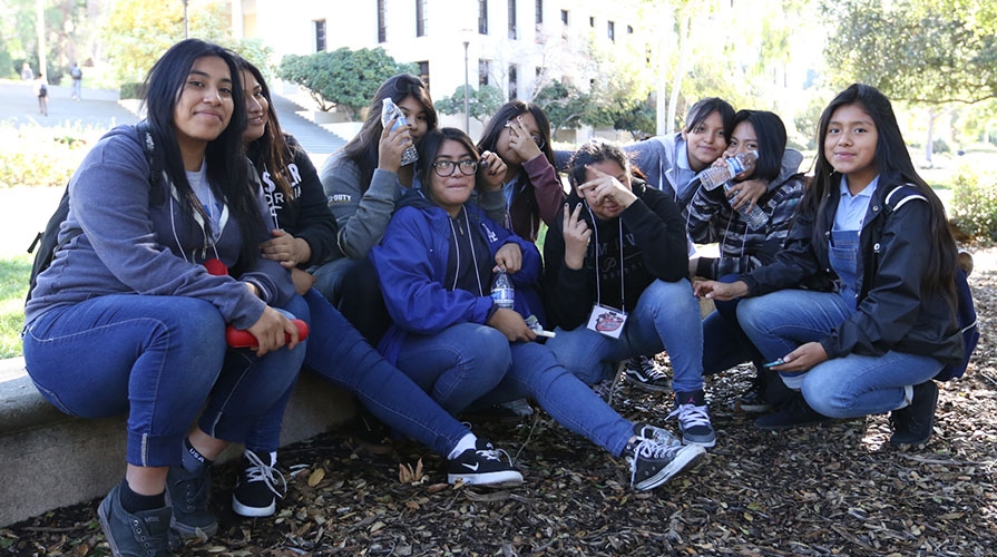 Middle-school students pose together on the Occidental College campus