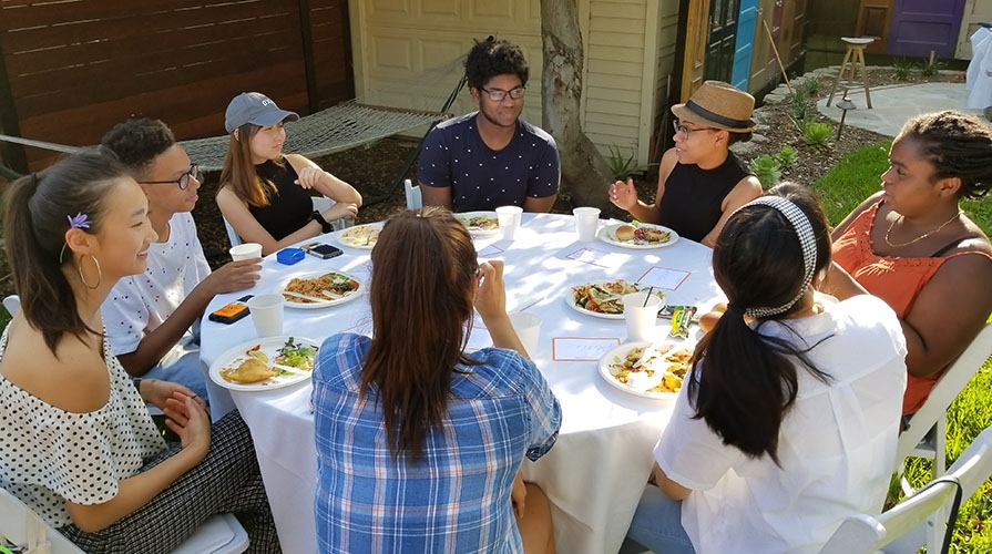 Students sitting at a table at a MVP event