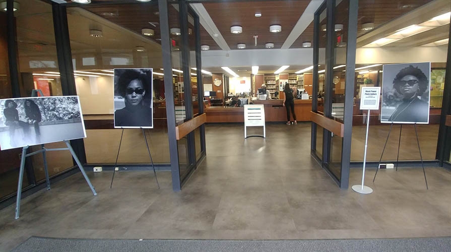 Art displayed in entryway to Academic Commons building on campus