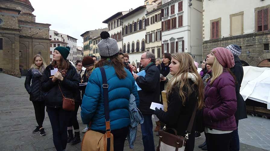 A class of Oxy students abroad look at surrounding architecture