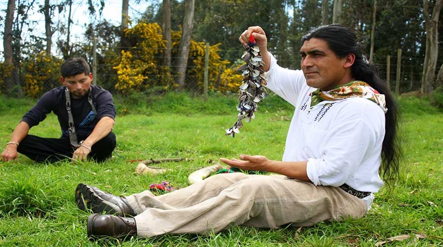 A man displays craftwork in Latin America