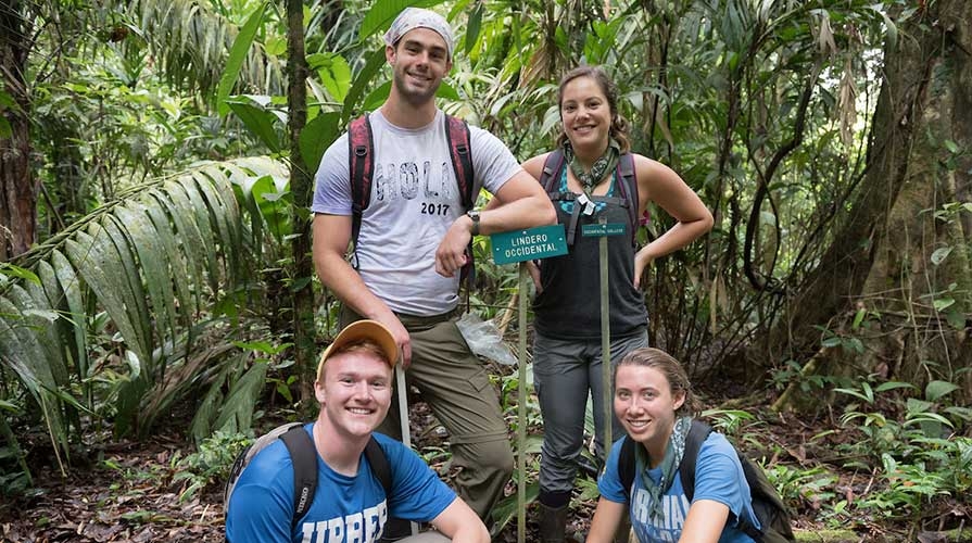 Students pose together in the jungle at La Selva