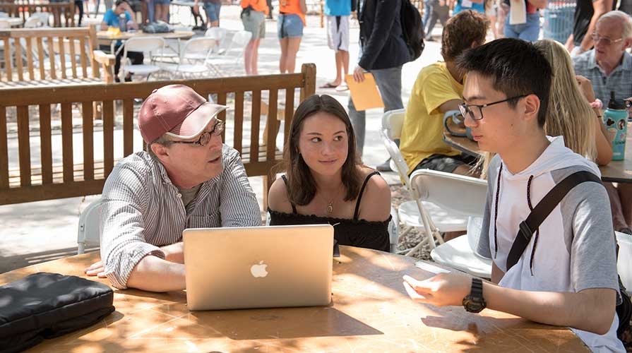 Students and a professor talking