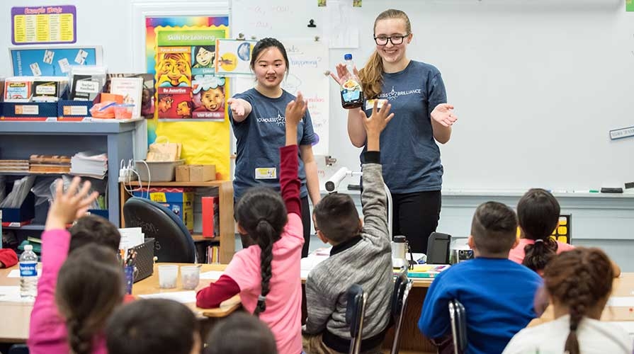 Oxy students volunteering in elementary school classrooms