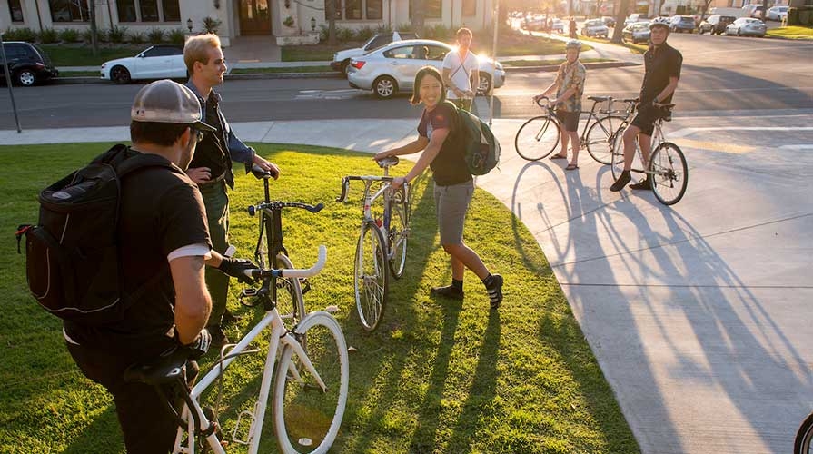 Oxy students on campus with their bikes