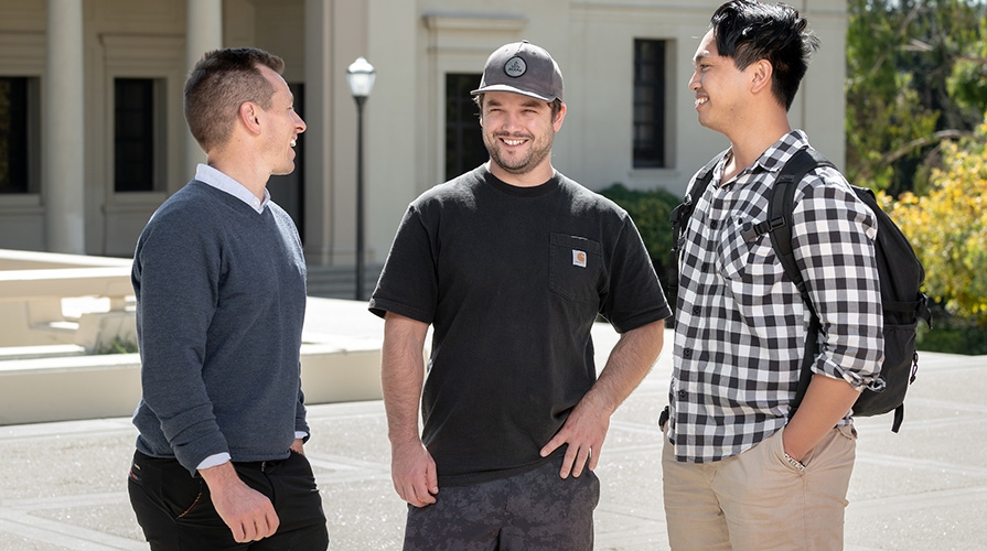 students talking together on campus