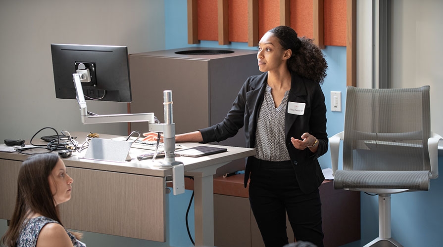 A student presents her research at the 2019 Summer Research Conference