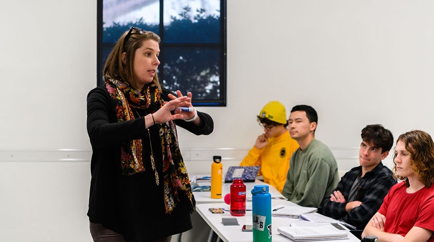 Professor Clair Morrissey in a classroom with her students