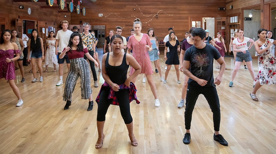 A group of students dancing in the Tiger Cooler