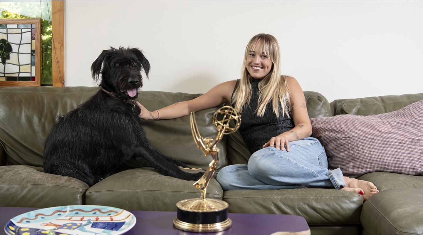 Two-time Emmy winner Emma Choate ’20 with her 2-year-old dog, George.