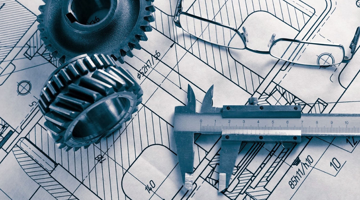 Engineering and draftsman's tools on top of engineering planning papers