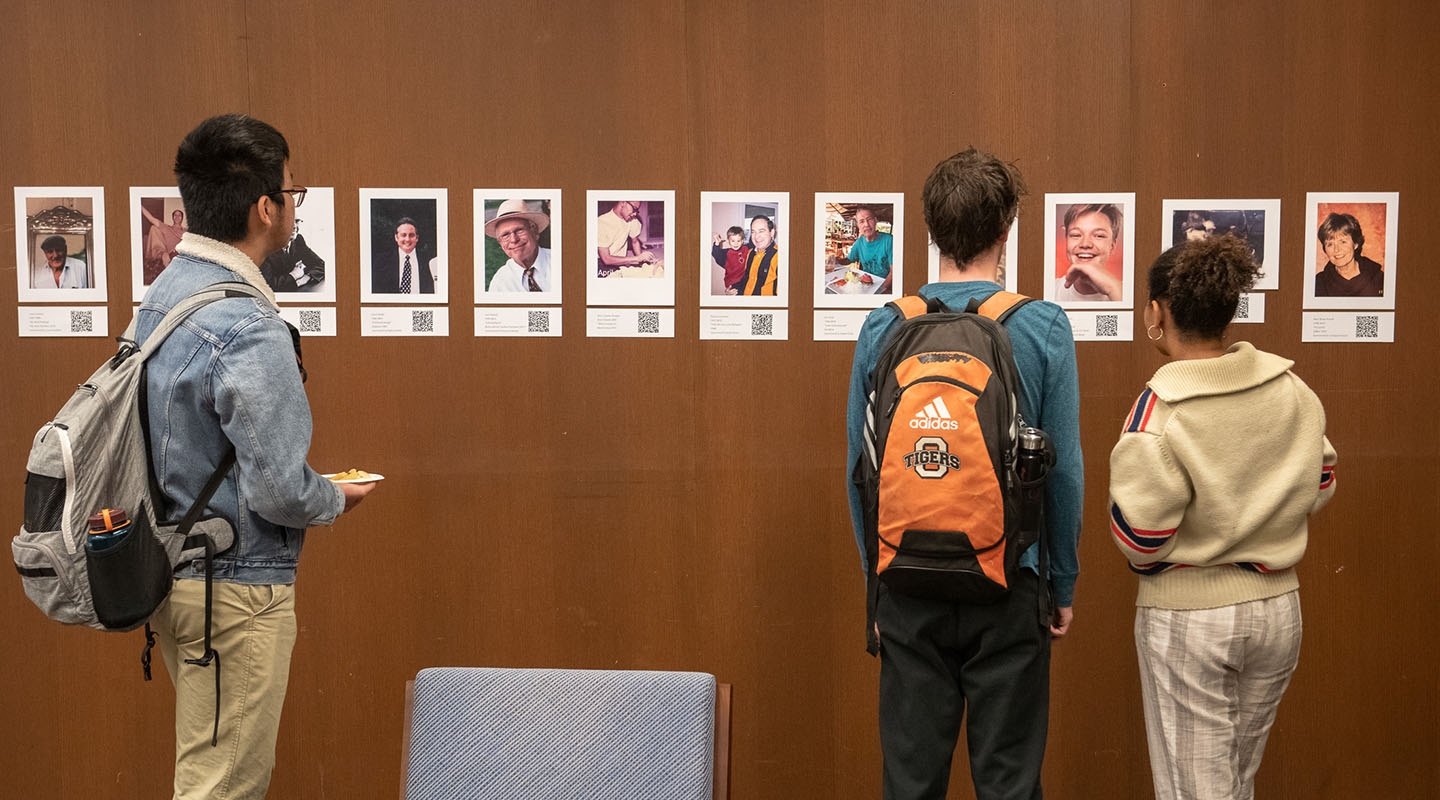 Students looking at an interactive exhibit in the Oxy library