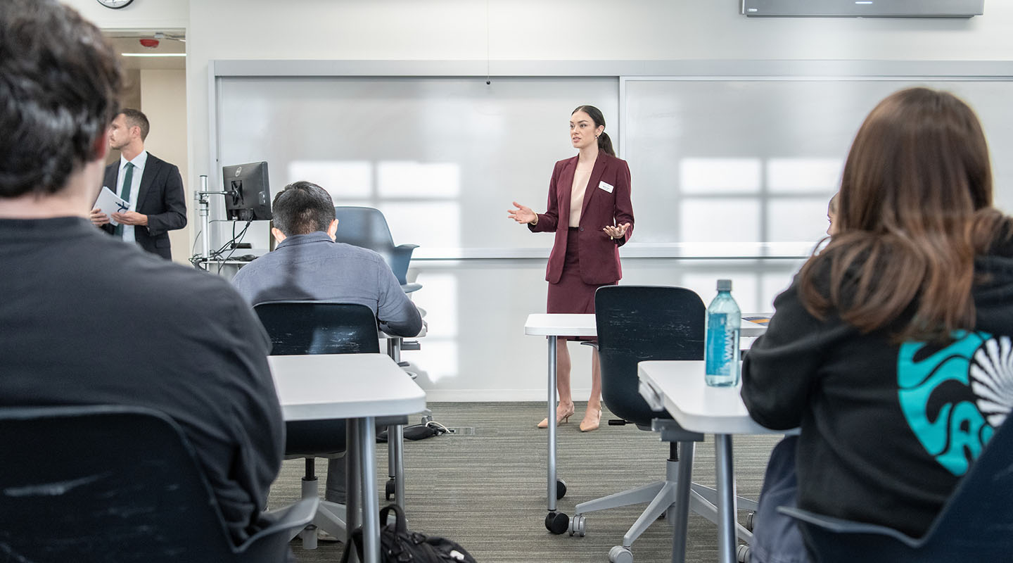 Occidental College professor Marisol Leon standing in front of a classroom of students, talking
