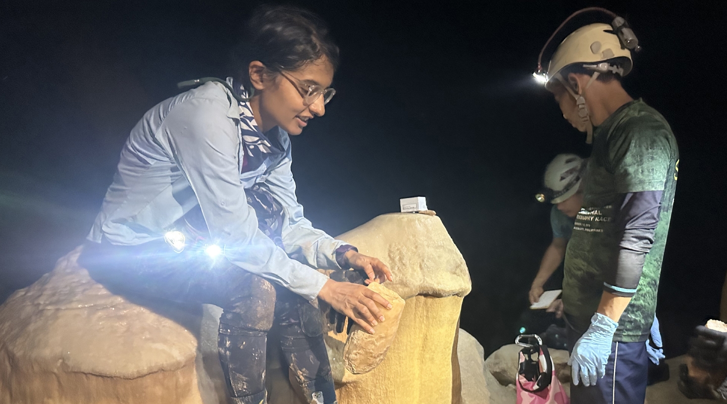 Assistant Professor Natasha Sekhon studies broken stalagmites to decide whether they should be brought back to the U.S. for further research. 