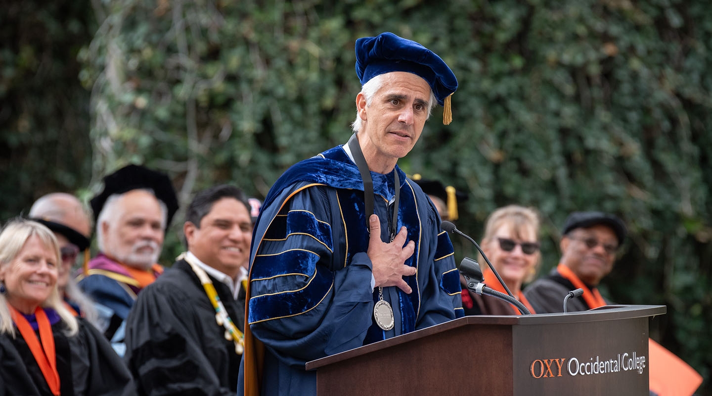 Occidental College President Tom Stritikus addresses the audience from the podium on his Inauguration Day
