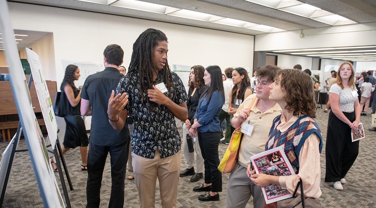 an Occidental College student presenting his undergraduate research project