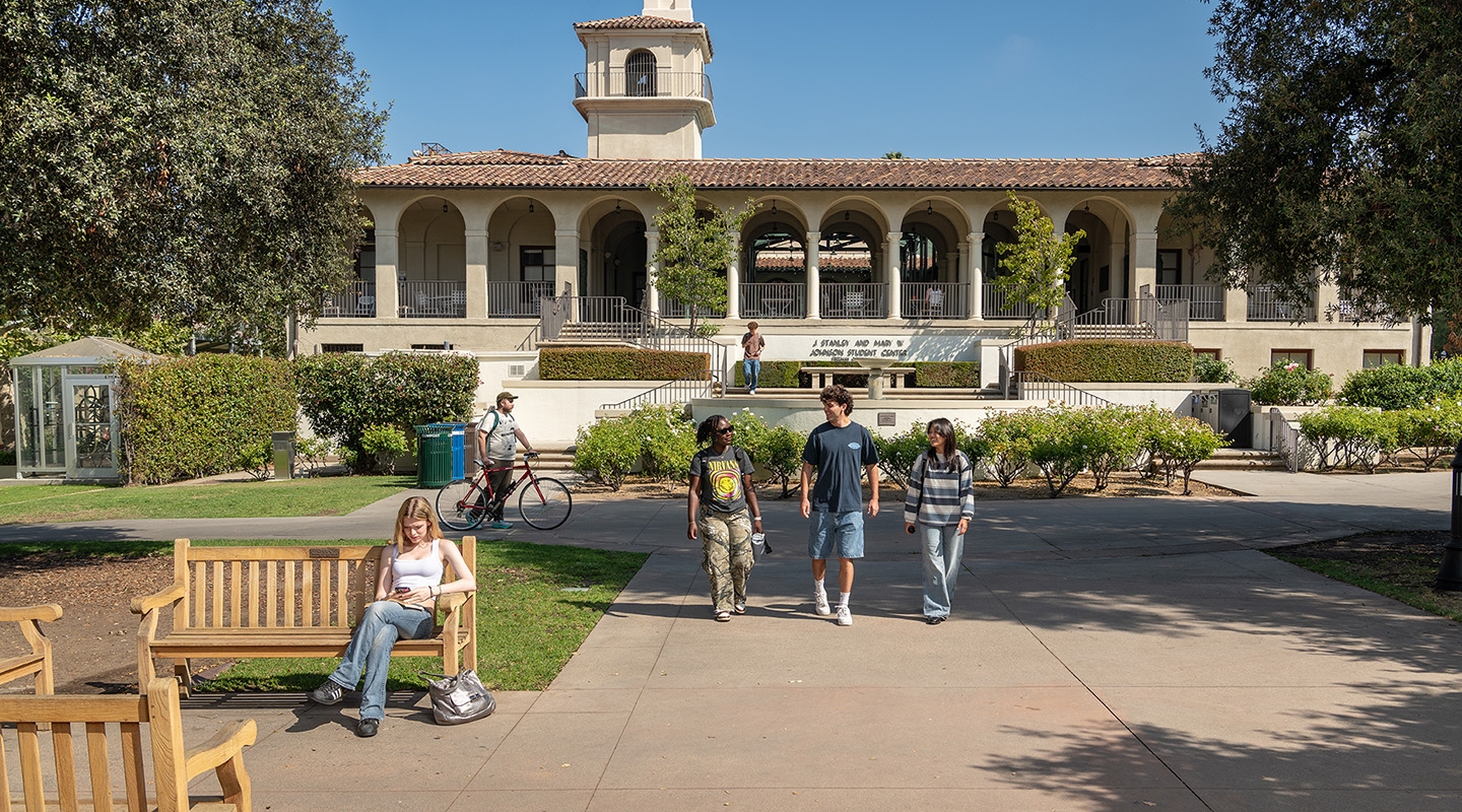 Occidental College students walk outside of the Johnson Student Center