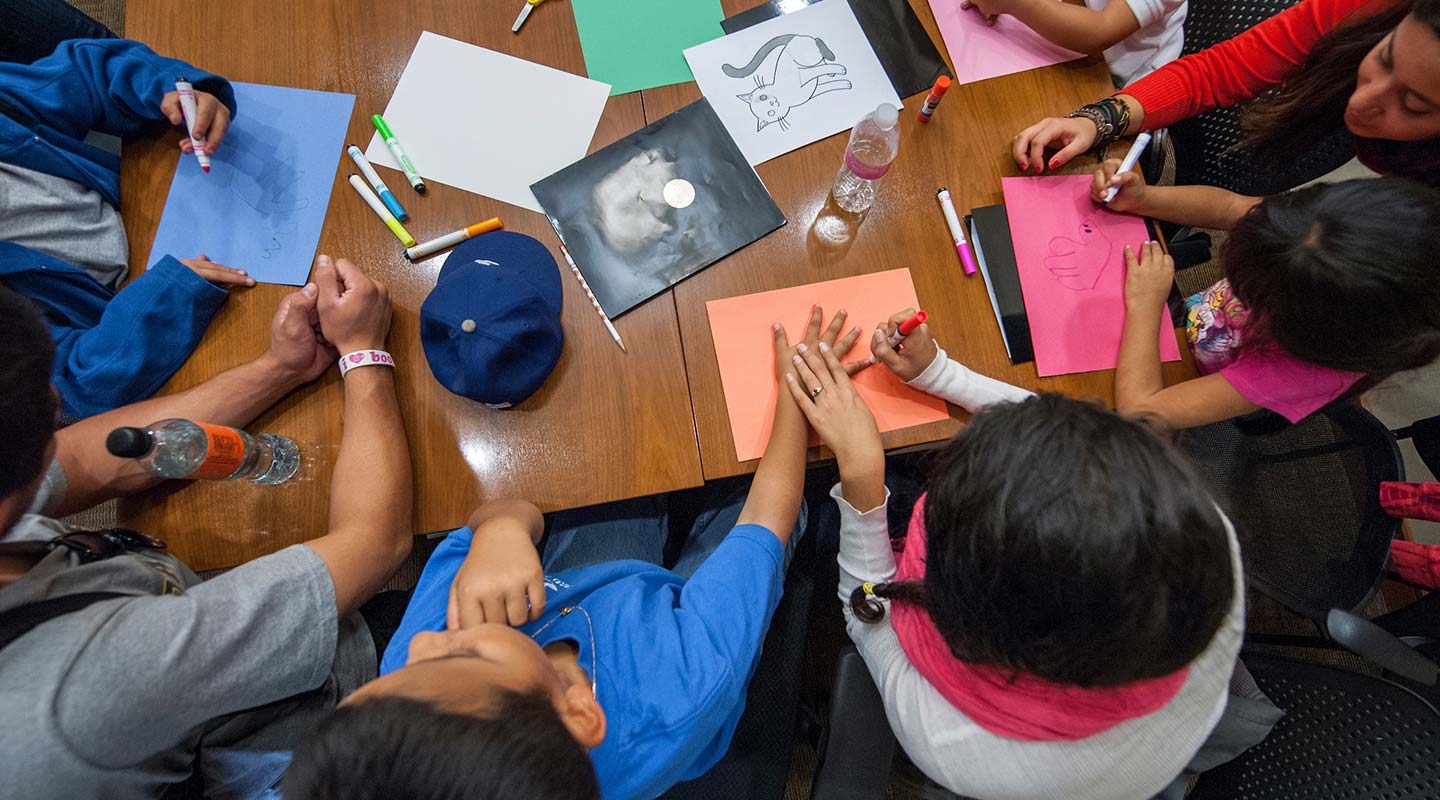 The California Immigration Semester (CIS) and Center for Community Based Learning (CCBL) hosts a group of local elementary school students as part of a "Day at College" event. 