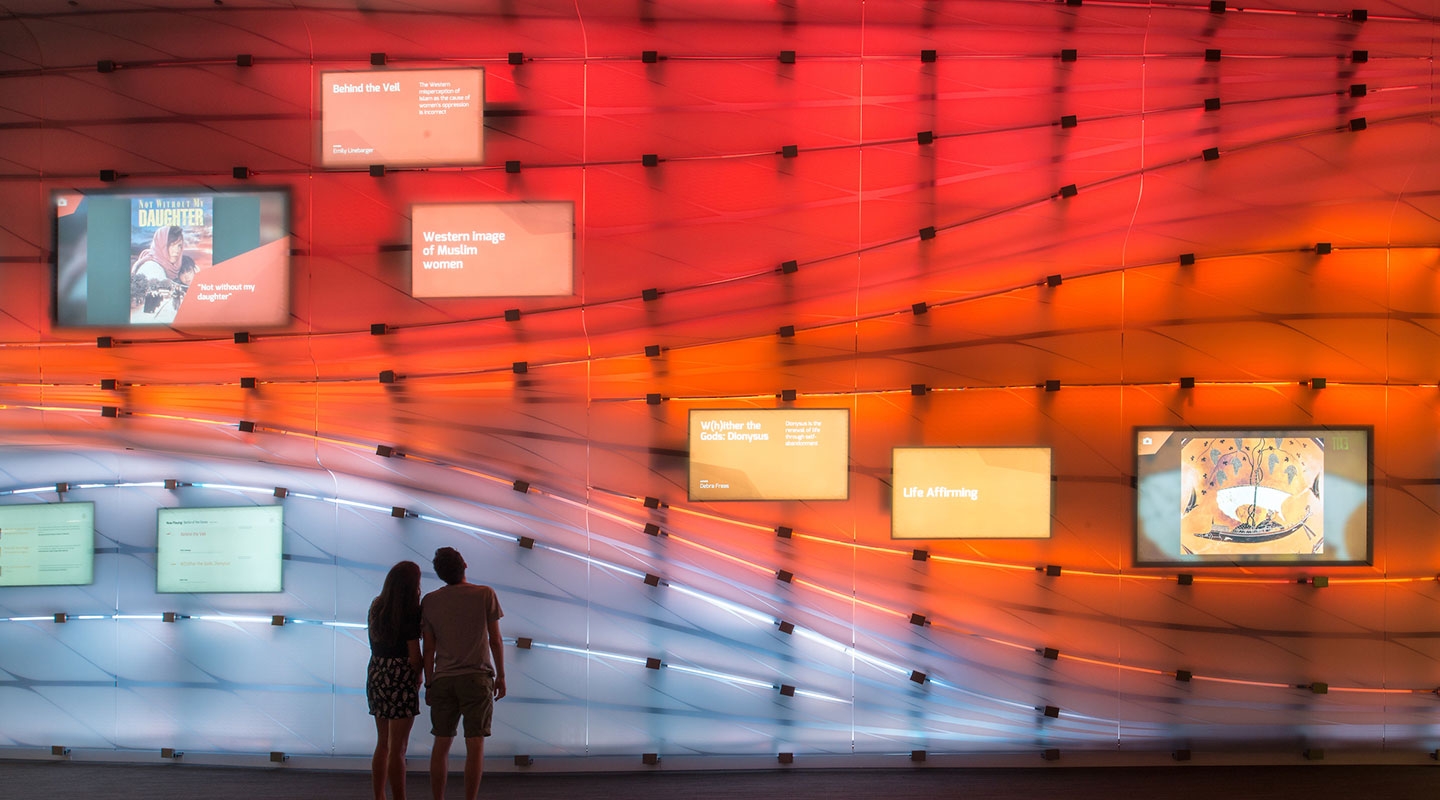 Students watch a Global Crossroads presentation on the McKinnon Center media wall