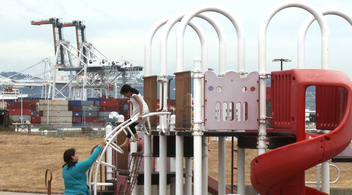 A child and adult at a playground