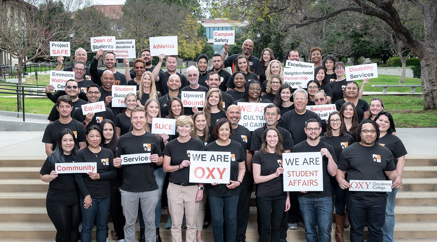 The Student Affairs team on the steps in front of the Academic Quad