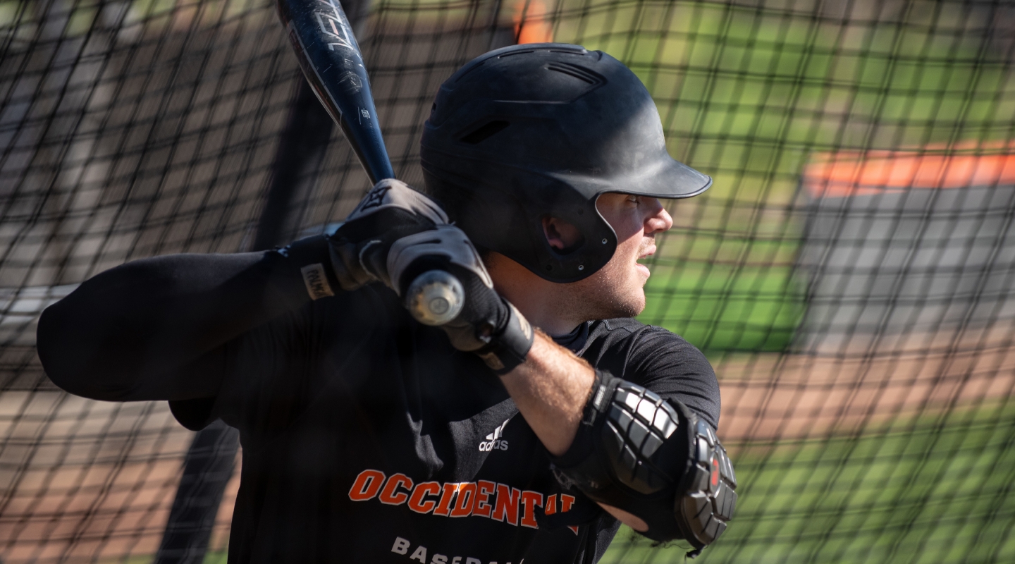 An Oxy baseball player takes batting practice on January 27, 2022.