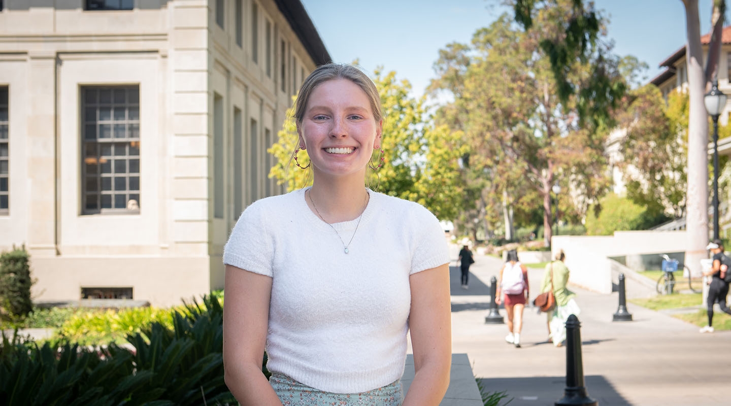 Amelia Muscott in front of the library