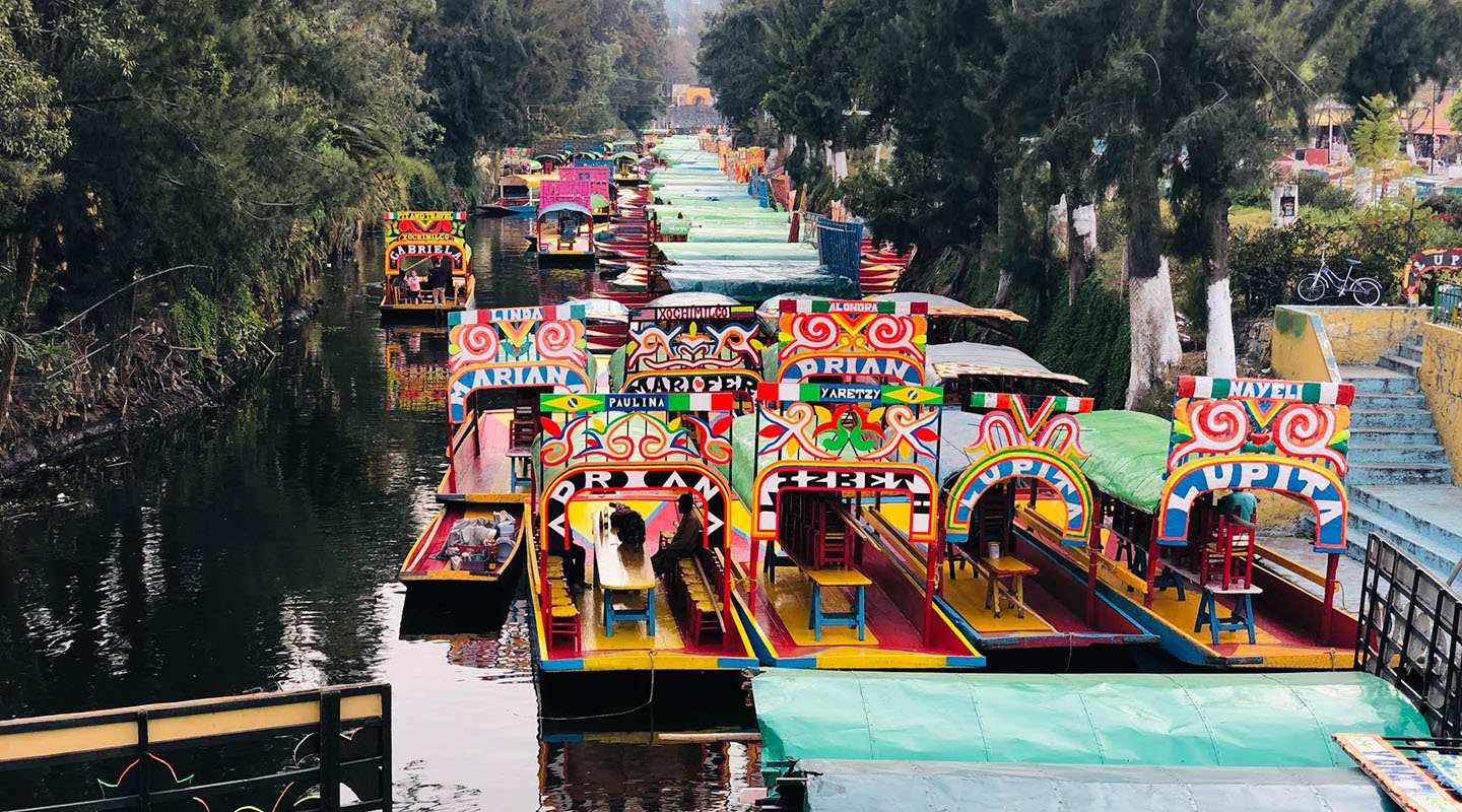 Colorful Trajinera boats at Xochimilco: showcasing a pre-hispanic canal system of Mexico City