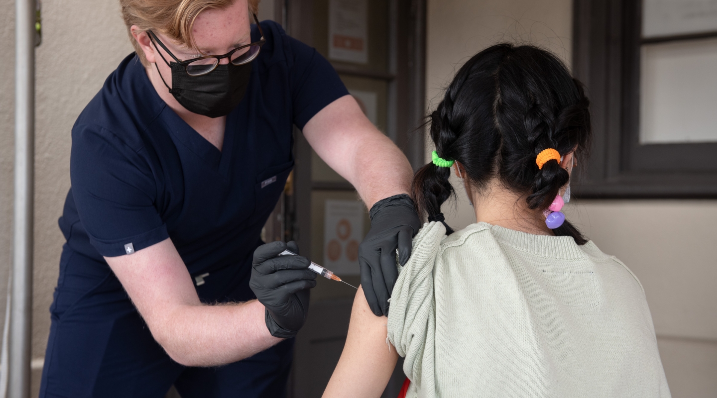 james vaccinating a student