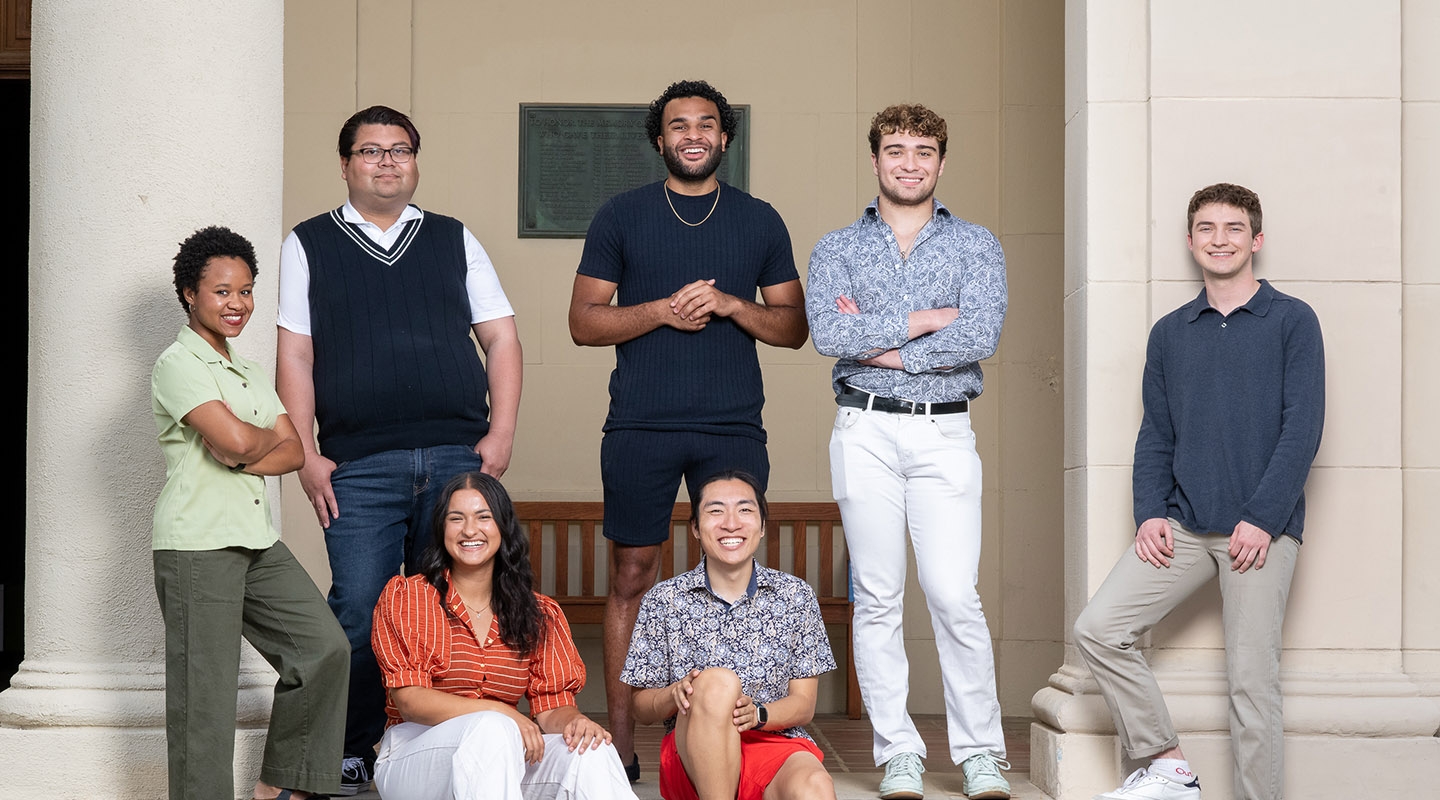 a group of 7 Obama Scholars students standing together outside