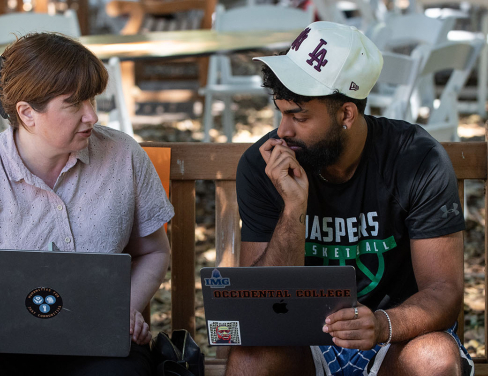 An Occidental College student talking to their academic adviser