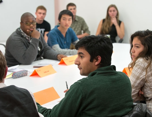 students sitting together around a table