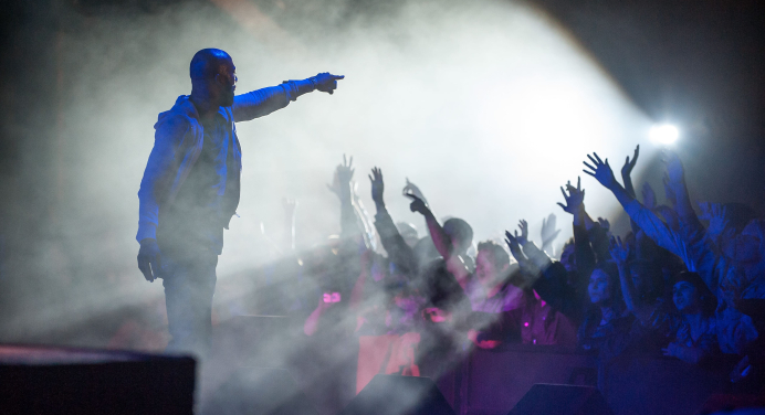 Picture of artist interacting with audience at concert