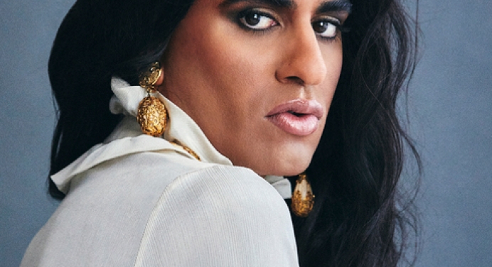 Headshot of ALOK with blue background