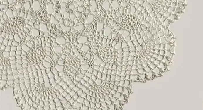 an elaborate white lace doily