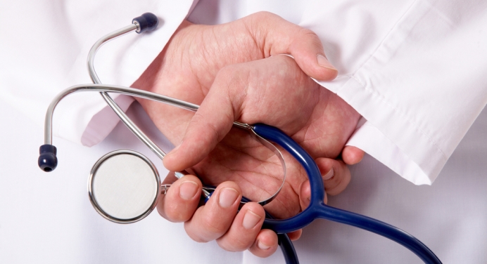 a doctor holding a stethoscope in his hands