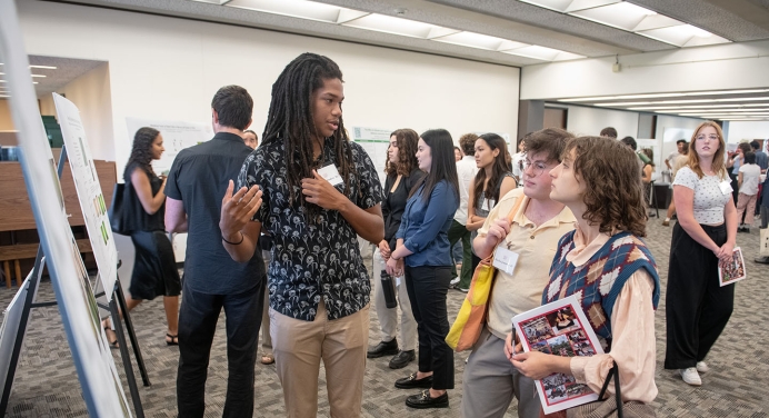 an Occidental College student presenting his undergraduate research project
