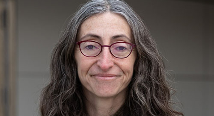 Yelena Gluzman in a black sweater and long hair