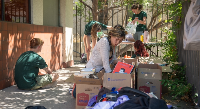A student finding second-hand dorm goods at the fall move in sale 2024