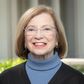 Maryann Horowitz headshot black sweater blue turtleneck