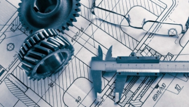 Engineering and draftsman's tools on top of engineering planning papers