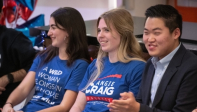 three Oxy student panel participants sit together smiling