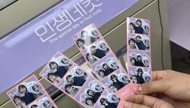 A close-up of photo booth photo strips showing friends posing together